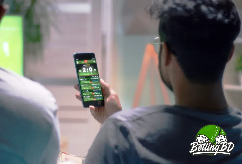 A man is betting on sports during a football match